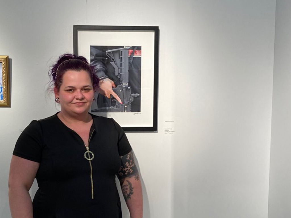 Elizabeth Terry in front of her award winning photograph Solidarity